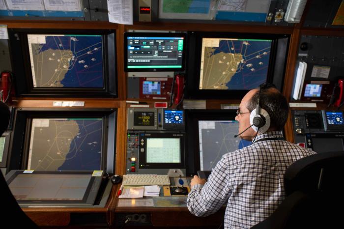 A member of NATS at work in the control tower at Aberdeen